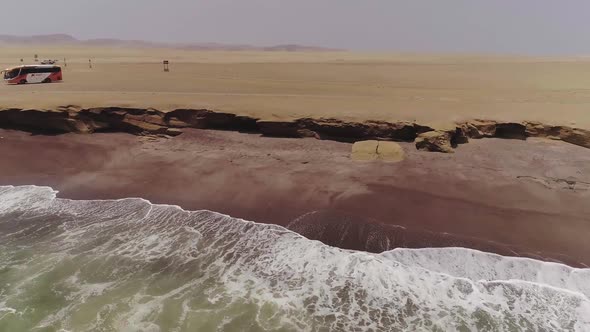 Amazing Multicolored Drone Footage of Green Waves Tide Clay Colored Shoreline