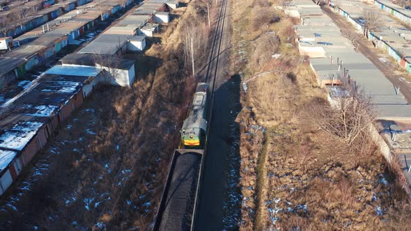 Cargo Train on a Railroad in Sunny Winter Day.  alt