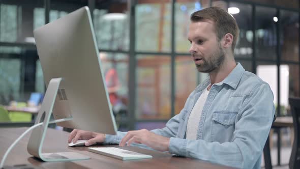 Happy Young Man Showing Thumbs Up alt