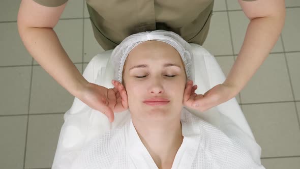 Masseuse Hands Move Doing Calming Face Massage Upper View alt