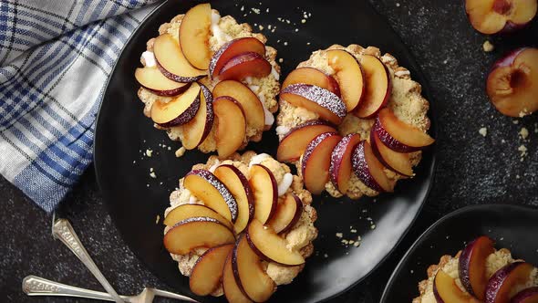 Delicious Homemade Mini Tarts with Fresh Sliced Plum Fruit alt