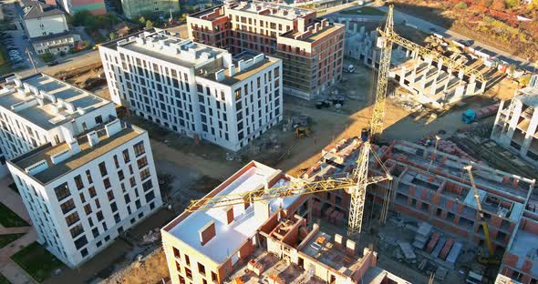 Panoramic View with Highrise Crane Under Construction Against Buildings alt