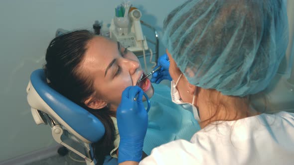 Dentist treats Teeth of Young Girl