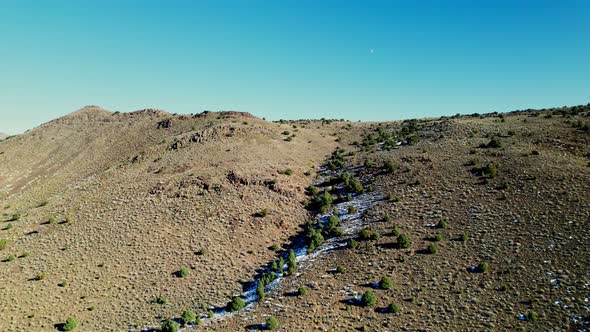 Aerial view over desert landscape in Mount Washington Nevada, sunny alt