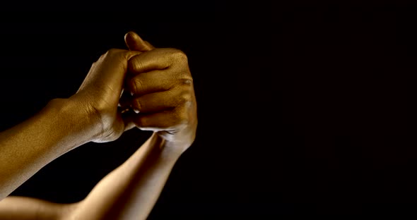 Hands of Young Woman Moving in Black Background, Skin Is Golden, Fashion Body-art alt