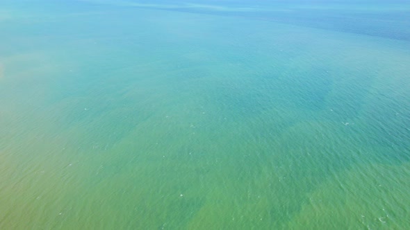 4K Aerial view of drone move on beautiful sea. Flight over ocean, open sea. alt