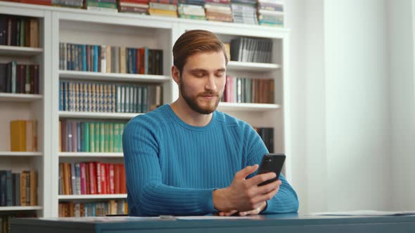 Attractive man talking using smartphone alt