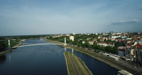 Aerial view of Osijek harbour along Drava river with Pjesacki bridge, Croatia. alt