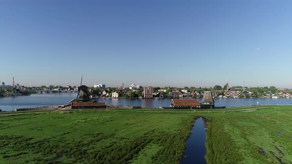 Aerial view of famous historic windmills of Zaanse Schans in Amsterdam, Netherlands in 4K