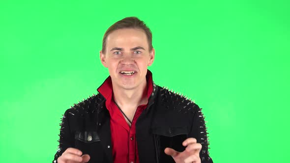Guy Looking at Camera with Anticipation, Then Very Upset. Green Screen alt