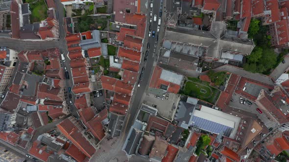 Birds View of European Town with Red Rooftops and Little Traffic and Empty Streets During alt