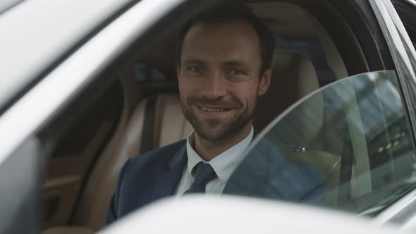 Luxury Car Driver Posing Smiling alt