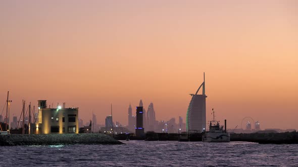 Dubai Marine and Burj Al Arab Skyline after Sunset, Orange Glow Sky. alt