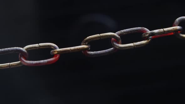 Weakest Link - Concept - Chain slowly heats up and starts to sparkle, chain collapses at the end alt