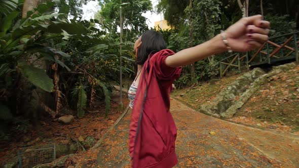 young girl turns around herself dreamy orbit shot alt