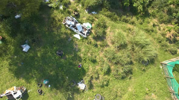 Flying Across Airsoft Shooting Grounds Sunny Day Bird's Eye View Aerial Drone alt