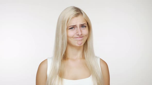 Portrait of Blondie Strict Woman Politely Expressing Denial Waving Head in Refusal Over White alt
