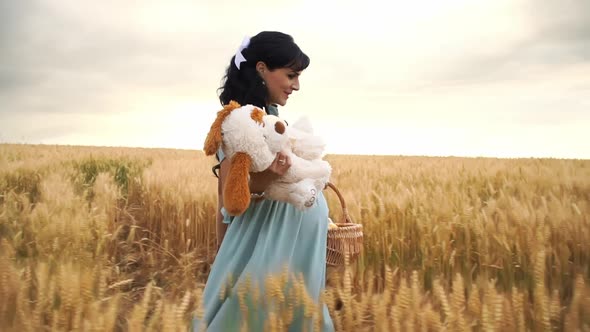 Pregnant Caucasian Lady Walks in a Meadow and Is Going To Have a Picnic on Nature in Slowmo alt