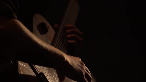 Male Guitarist Plays the Guitar in the Dark. Kyiv. Ukraine alt