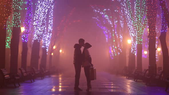 Couple kissing at night alley in Odesa, Ukraine