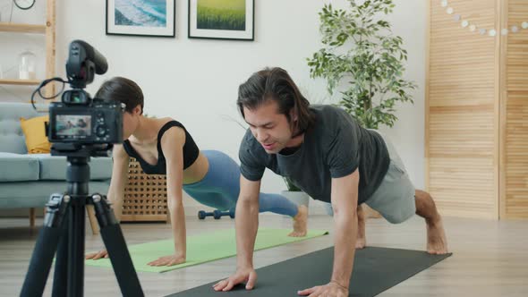 Husband and Wife Vloggers Doing Sports and Recording Video Speaking and Using Professional Camera alt