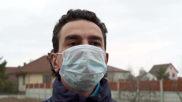 Italian Man in Medical Mask Outdoors Looking Scared Shocked and Frustrated
