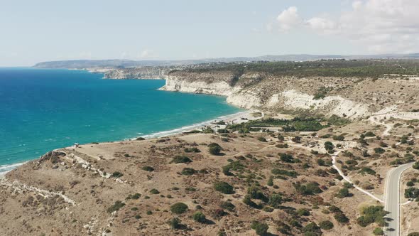 Aerial View of the Rocky Shore of the Sea Against the Rocks alt