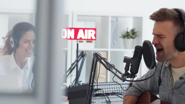 Handsome Man Singing in Studio alt