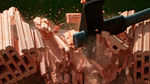 Super Slow Motion Shot of Smashing Brick with Sledgehammer at 1000Fps alt