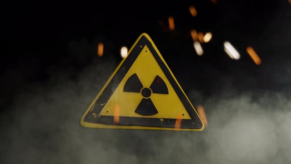 Ionizing Radiation Sign Over a Smoky Background