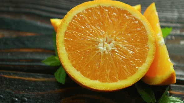Sliced Orange with Green Leaves  alt