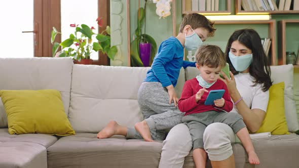 Mother with Her Two Kids with Protective Mask alt