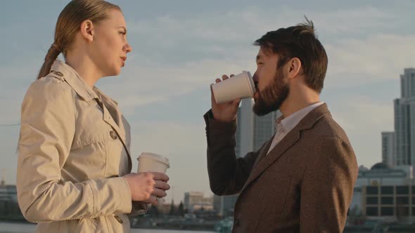 Chatting with Colleague Outdoor in the Morning alt