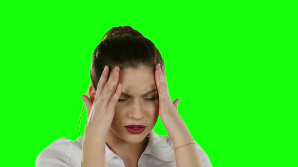 Young Businesswoman with Tired Eyes and Headache. Green Screen alt