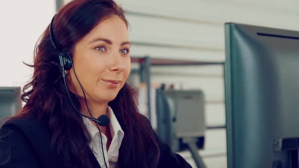 Business People Wearing Headset Working in Office alt
