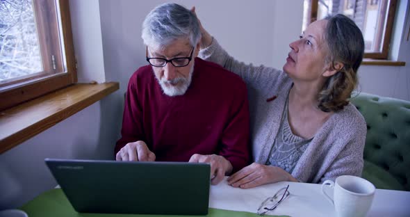 an Old Woman Takes Care of Her Husband While He Works Strokes His Head and Snuggles Up to His alt