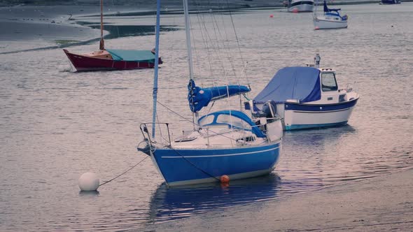 Boats Moored In Pink Evening Lighting alt