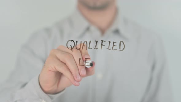 Qualified Leads Writing on Screen with Hand alt