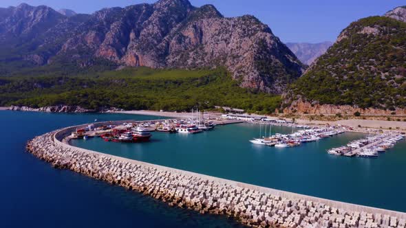 Panoramic Aerial View of Sailing Boats and Yachts Anchored in Turquoise Sea Bay alt