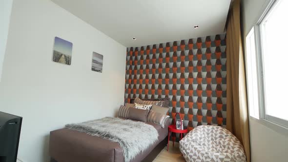 Trendy Bedroom Decoration With Graphic Wallpaper alt