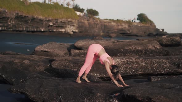 Side View of Sexy Girl in Tight Sportswear Stretch Her Legs and Glutes alt