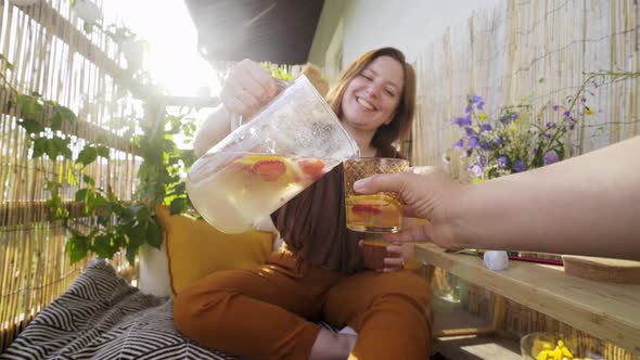 Girlfriends Drink Lemonade on Summer Terrace