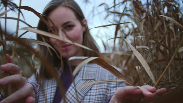 Beautiful Woman In Plants In Countryside alt