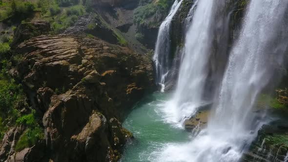 Waterfall Between Cliffs. alt