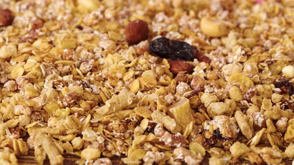 Granola Oat Flakes with Dried Fruits and Nuts Close Up for Background
