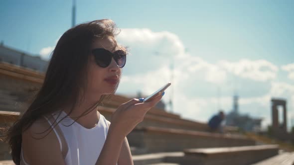 Girl Using Smart Phone Voice Recognition, Dictates Thoughts, Voice Dialing Message at Night Evening alt