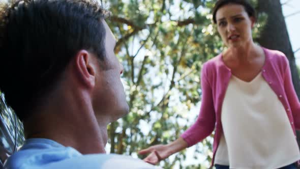 Couple into an argument with each other near car alt