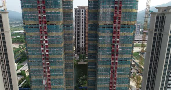 Aerial footage of multistory apartment construction site in China alt