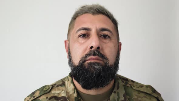 Military soldier looking at camera alt
