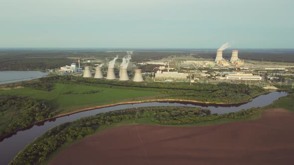 Nuclear power plant cooling towers emissions of steam in the air atmosphere alt